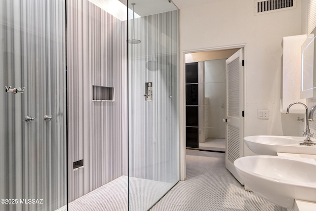 388 S Convent Ave, Tucson, AZ 85701 - full bath with walk in shower, double vanity, and tile patterned floors