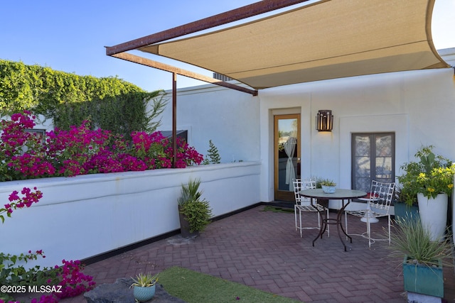 388 S Convent Ave, Tucson, AZ 85701 - view of patio / terrace featuring french doors and outdoor dining space