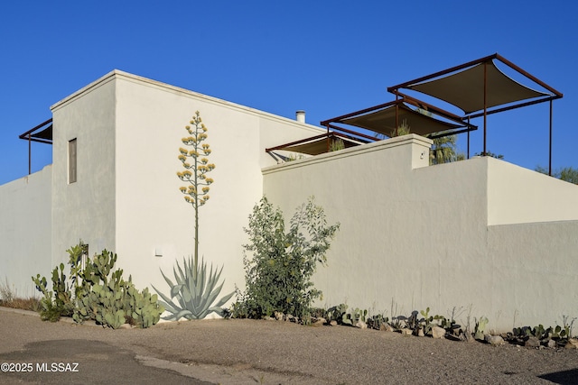 388 S Convent Ave, Tucson, AZ 85701 - view of property exterior featuring stucco siding