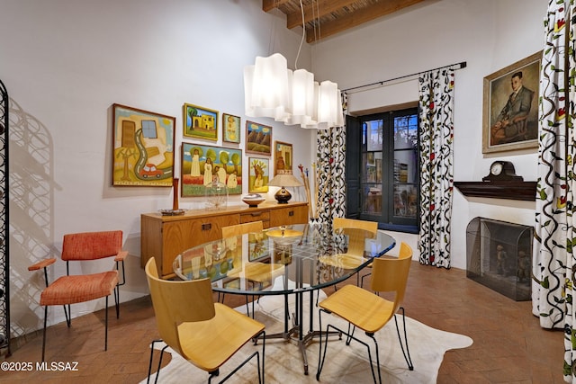 388 S Convent Ave, Tucson, AZ 85701 - dining space with brick flooring and a fireplace with flush hearth