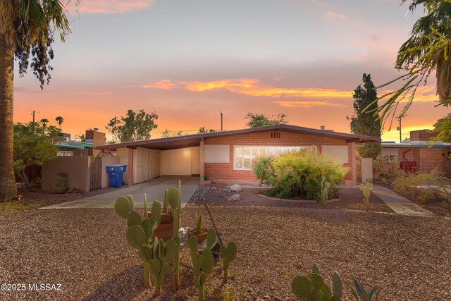 5826 E Hawthorne St, Tucson, AZ 85711 - view of front of property featuring driveway and an attached carport