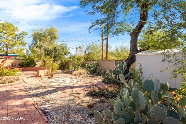 5826 E Hawthorne St, Tucson, AZ 85711 - fenced backyard featuring a patio