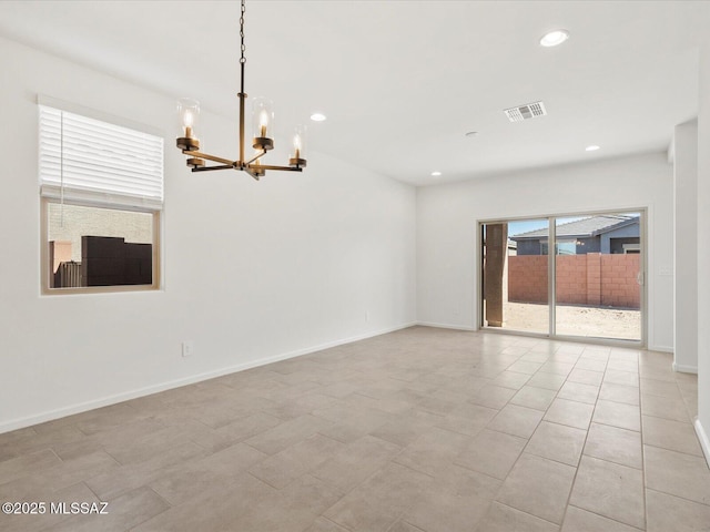 13097 N Farmhouse Ln, Marana, AZ 85653 - spare room with a chandelier, recessed lighting, and baseboards