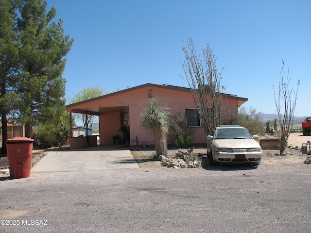 487 E Patrick Dr, Benson, AZ 85602 - view of front facade with concrete driveway and a carport