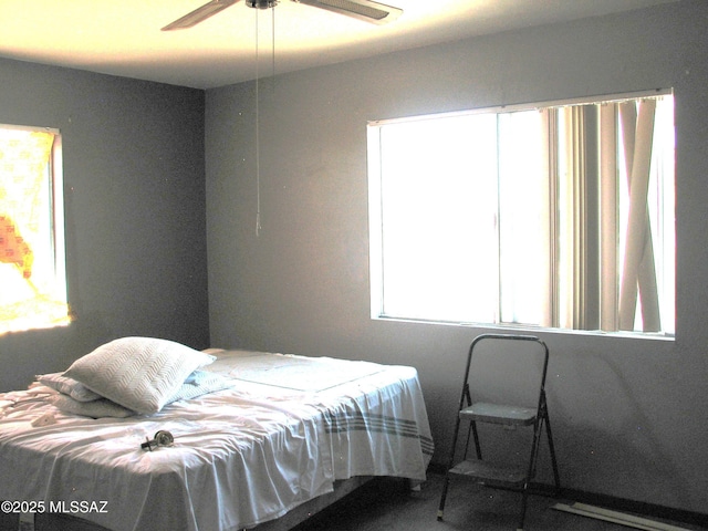 487 E Patrick Dr, Benson, AZ 85602 - carpeted bedroom featuring a ceiling fan