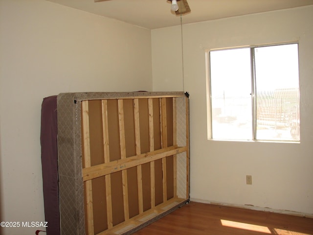 487 E Patrick Dr, Benson, AZ 85602 - spare room featuring wood finished floors and a ceiling fan