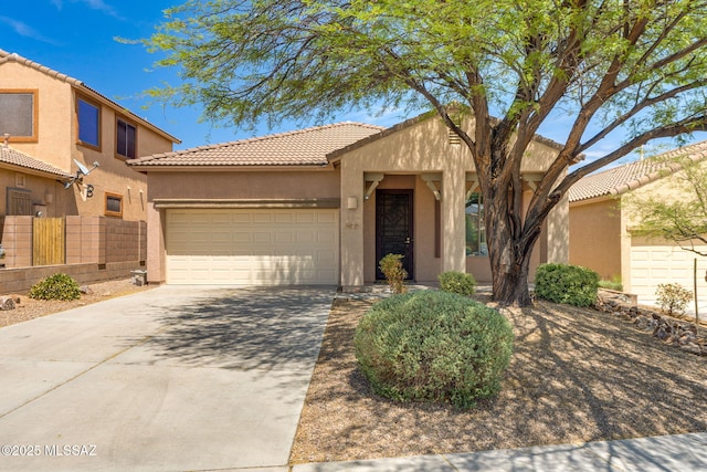12970 N Topanga Dr, Tucson, AZ 85755 - view of front facade with an attached garage, stucco siding, concrete driveway, and a tile roof