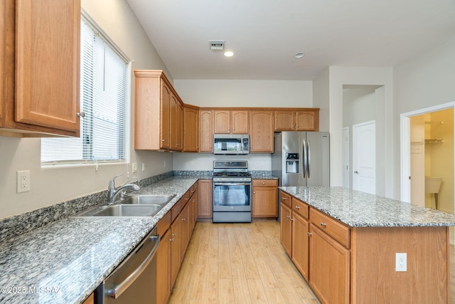 12970 N Topanga Dr, Tucson, AZ 85755 - kitchen with appliances with stainless steel finishes, a sink, light wood-style floors, plenty of natural light, and recessed lighting