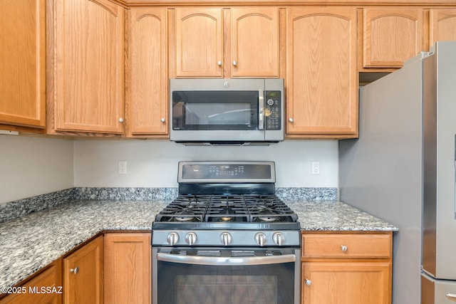12970 N Topanga Dr, Tucson, AZ 85755 - kitchen featuring stainless steel appliances, light stone counters, and light brown cabinetry