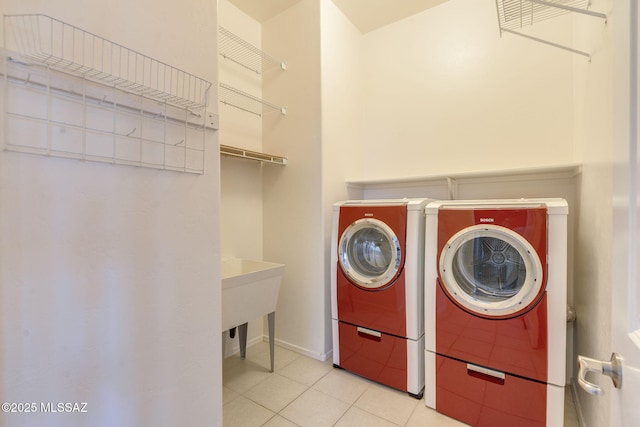 12970 N Topanga Dr, Tucson, AZ 85755 - laundry room with washing machine and clothes dryer, tile patterned floors, and baseboards