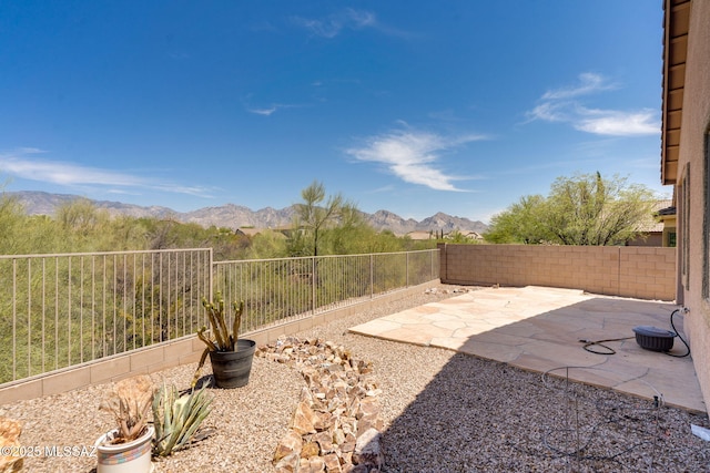 12970 N Topanga Dr, Tucson, AZ 85755 - fenced backyard featuring a mountain view and a patio area