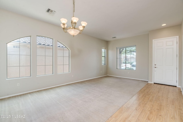 12970 N Topanga Dr, Tucson, AZ 85755 - empty room featuring a chandelier, wood finished floors, baseboards, and recessed lighting