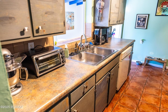 453 W Union St, Benson, AZ 85602 - kitchen featuring a sink, white dishwasher, dark tile patterned flooring, and baseboards