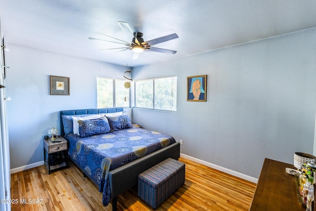 453 W Union St, Benson, AZ 85602 - bedroom featuring baseboards, wood finished floors, and ceiling fan