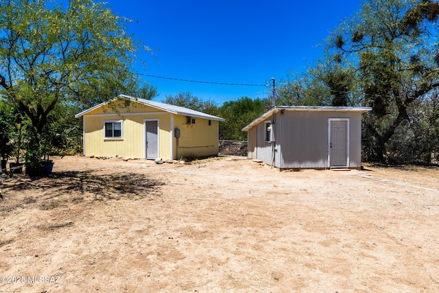453 W Union St, Benson, AZ 85602 - rear view of house featuring an outbuilding