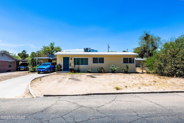 453 W Union St, Benson, AZ 85602 - ranch-style house with driveway and metal roof