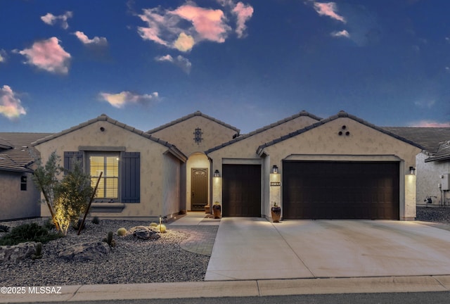 62146 E Marble Dr, Oracle, AZ 85623 - mediterranean / spanish-style house featuring a garage, driveway, stucco siding, and a tile roof