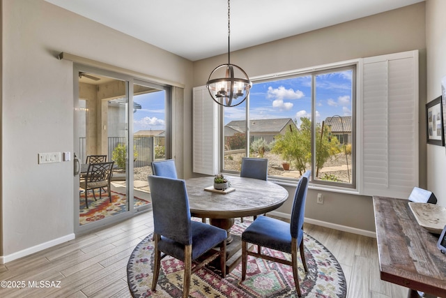 62146 E Marble Dr, Oracle, AZ 85623 - dining space with a chandelier, plenty of natural light, and light wood-style floors