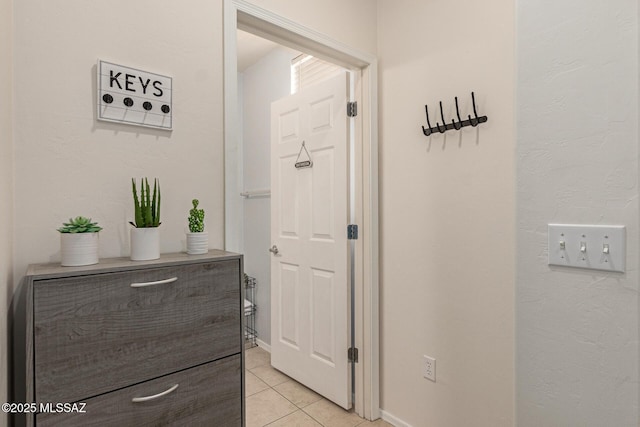7952 E Revolution Loop, Tucson, AZ 85730 - hall featuring light tile patterned floors and baseboards