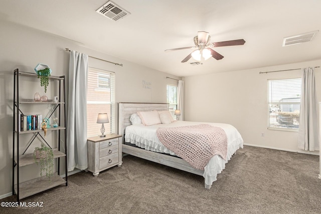 7952 E Revolution Loop, Tucson, AZ 85730 - carpeted bedroom with ceiling fan and baseboards