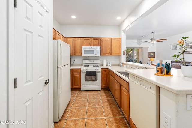 731 W Calle Montero, Sahuarita, AZ 85629 - kitchen featuring white appliances, a peninsula, light countertops, light tile patterned floors, and recessed lighting