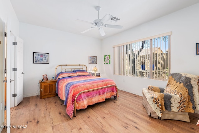 731 W Calle Montero, Sahuarita, AZ 85629 - bedroom featuring wood finished floors, baseboards, and a ceiling fan