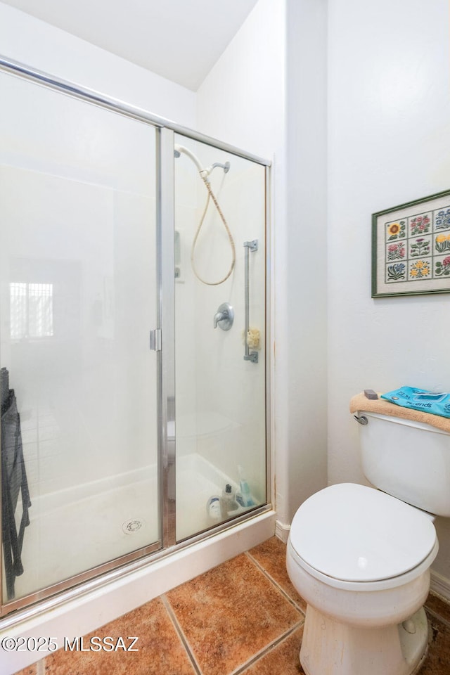 731 W Calle Montero, Sahuarita, AZ 85629 - bathroom featuring toilet, a shower stall, and tile patterned floors