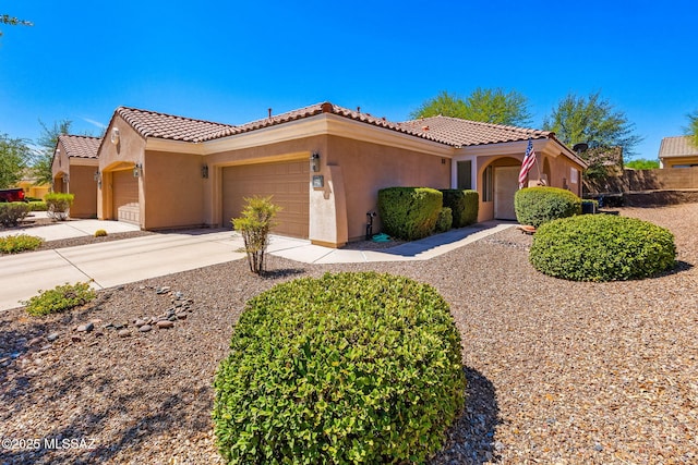 731 W Calle Montero, Sahuarita, AZ 85629 - mediterranean / spanish house with a garage, stucco siding, a tiled roof, and concrete driveway
