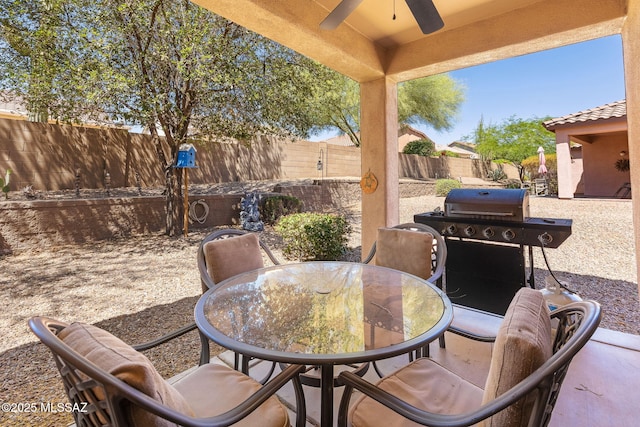 731 W Calle Montero, Sahuarita, AZ 85629 - fenced backyard with ceiling fan, outdoor dining space, a grill, and a patio area