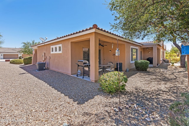 731 W Calle Montero, Sahuarita, AZ 85629 - view of side of property featuring stucco siding, a tile roof, ceiling fan, a patio, and cooling unit