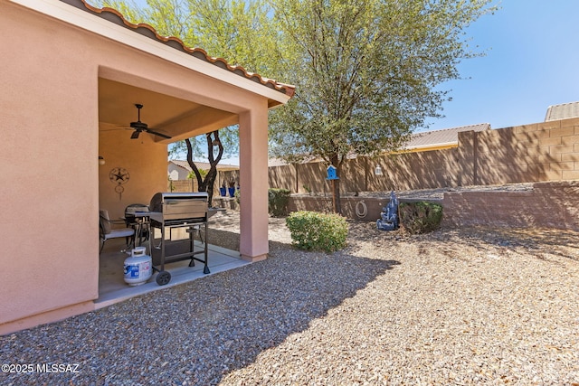 731 W Calle Montero, Sahuarita, AZ 85629 - fenced backyard with ceiling fan and a patio area