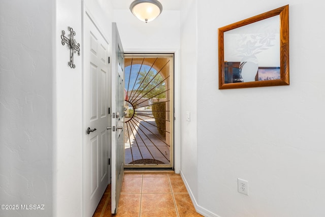 731 W Calle Montero, Sahuarita, AZ 85629 - doorway to outside featuring light tile patterned flooring and baseboards