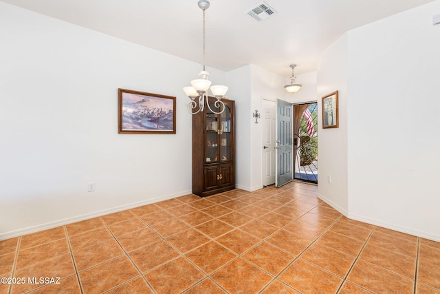 731 W Calle Montero, Sahuarita, AZ 85629 - spare room featuring a chandelier, light tile patterned flooring, and baseboards