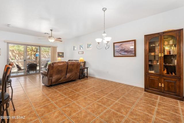 731 W Calle Montero, Sahuarita, AZ 85629 - living area featuring a chandelier, a ceiling fan, light tile patterned floors, and baseboards