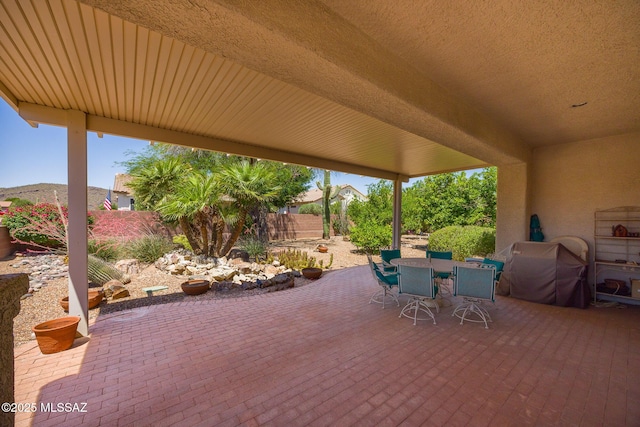 9345 N Cottage Garden Pl, Tucson, AZ 85743 - fenced backyard featuring outdoor dining area and a patio area