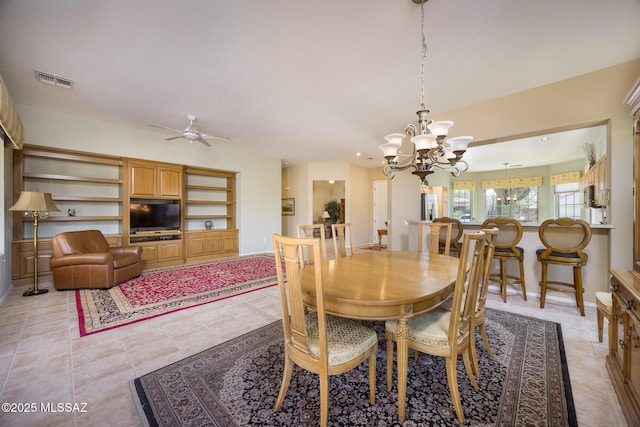 9345 N Cottage Garden Pl, Tucson, AZ 85743 - dining area featuring a chandelier, light tile patterned floors, and a ceiling fan