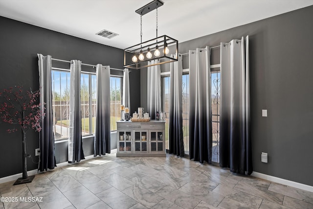 3630 W Center Mountain Way, Tucson, AZ 85746 - unfurnished dining area featuring baseboards