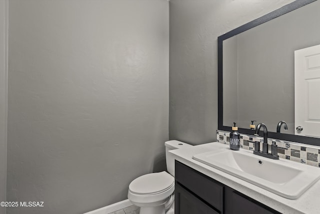 3630 W Center Mountain Way, Tucson, AZ 85746 - bathroom with vanity, decorative backsplash, and a textured wall