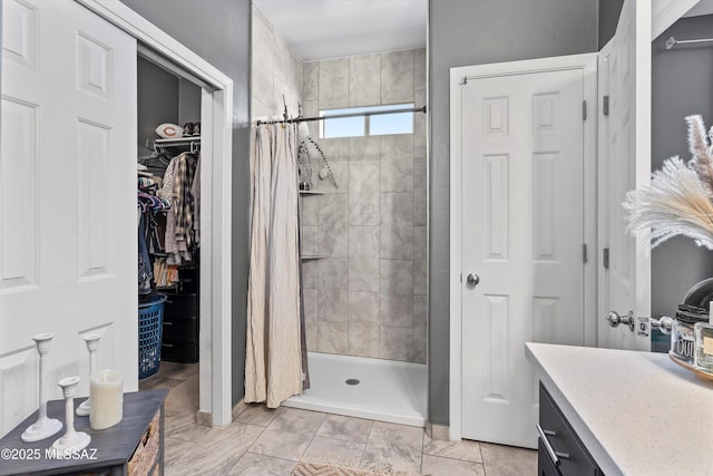 3630 W Center Mountain Way, Tucson, AZ 85746 - bathroom featuring a shower stall, vanity, and a spacious closet