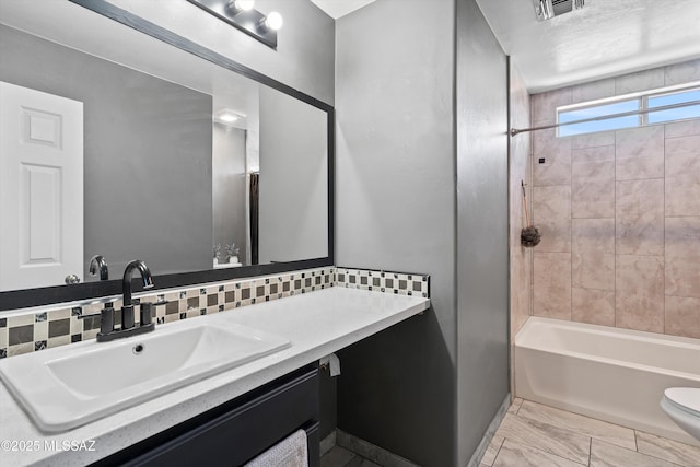 3630 W Center Mountain Way, Tucson, AZ 85746 - bathroom with vanity,  shower combination, marble look tile flooring, and backsplash