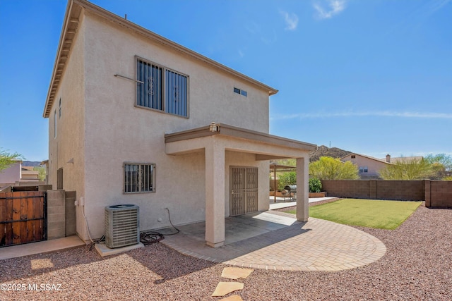 3630 W Center Mountain Way, Tucson, AZ 85746 - back of house featuring a patio area, a fenced backyard, stucco siding, and a gate