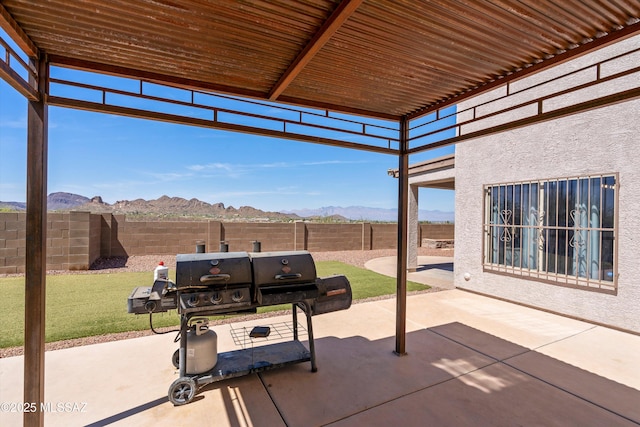 3630 W Center Mountain Way, Tucson, AZ 85746 - fenced backyard with a mountain view, a patio, and area for grilling