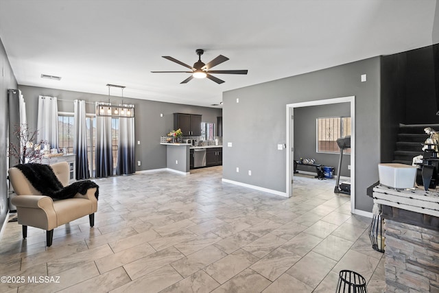 3630 W Center Mountain Way, Tucson, AZ 85746 - living area with a ceiling fan and baseboards