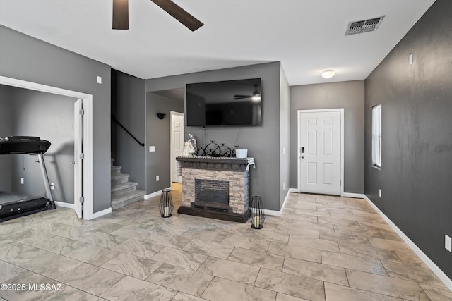 3630 W Center Mountain Way, Tucson, AZ 85746 - living area with ceiling fan, stairs, and a stone fireplace