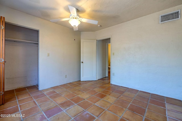 318 N Fremont Ave, Tucson, AZ 85719 - unfurnished bedroom featuring a closet and ceiling fan