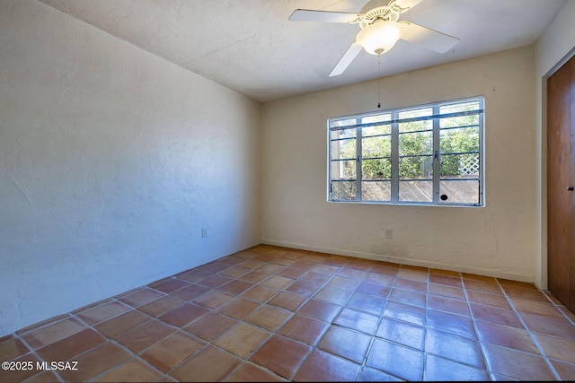 318 N Fremont Ave, Tucson, AZ 85719 - spare room featuring a textured wall, tile patterned flooring, and a ceiling fan