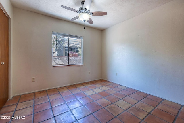 318 N Fremont Ave, Tucson, AZ 85719 - tiled empty room with a ceiling fan, baseboards, and a textured ceiling