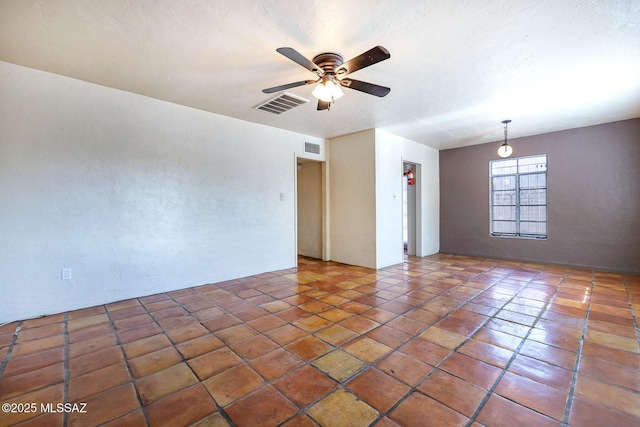 318 N Fremont Ave, Tucson, AZ 85719 - unfurnished room with a ceiling fan and a textured wall