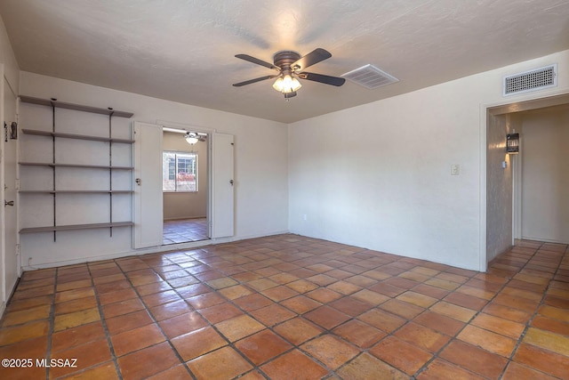 318 N Fremont Ave, Tucson, AZ 85719 - tiled empty room featuring a ceiling fan and a textured ceiling