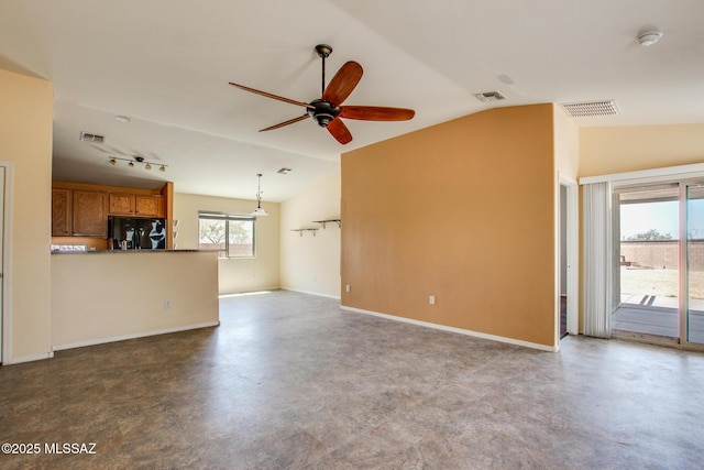 8068 S Nautilus Dr, Tucson, AZ 85756 - unfurnished living room with vaulted ceiling, ceiling fan, baseboards, track lighting, and finished concrete floors
